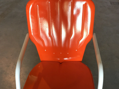 Orange powder coating finish on a metal chair